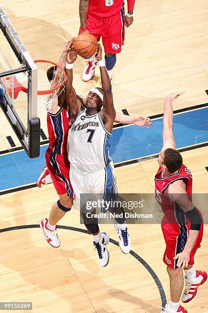 Andray Blatche of the Washington Wizards puts a shot up against the New Jersey Nets during the game at the Verizon Center on April 4, 2010 in...