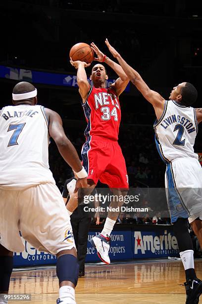 Devin Harris of the New Jersey Nets makes a jumpshot against the Washington Wizards during the game at the Verizon Center on April 4, 2010 in...