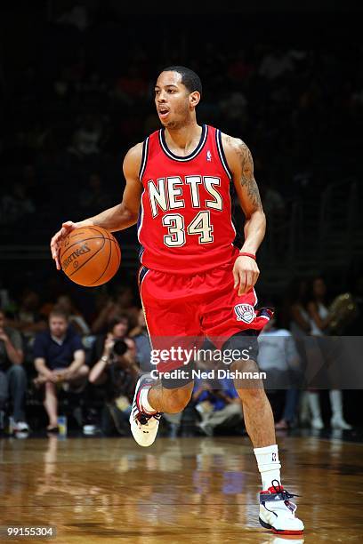 Devin Harris of the New Jersey Nets dribbles against the Washington Wizards during the game at the Verizon Center on April 4, 2010 in Washington,...