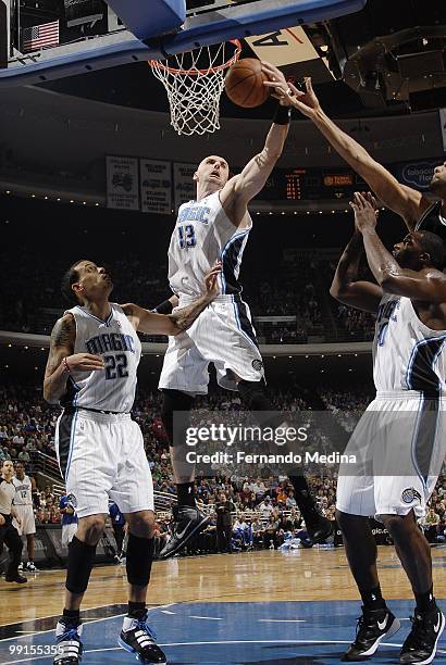 Marcin Gortat of the Orlando Magic makes a layup against the San Antonio Spurs during the game at Amway Arena on March 17, 2010 in Orlando, Florida....