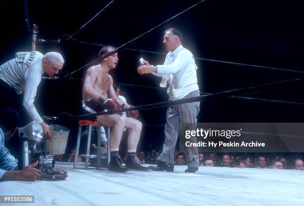 Frankie Ryff is looked at by his handlers between rounds during his 1956 Lightweight Bout against Larry Boardman on June 1, 1956 at Madison Square...