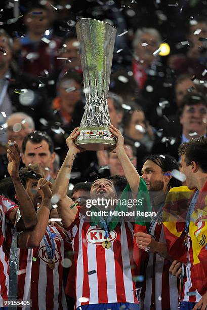 Simao of Atletico Madrid lifts the UEFA Europa League trophy following his team's victory after extra time at the end of the UEFA Europa League final...