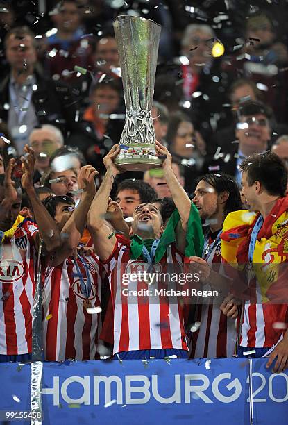 Antonio Lopez of Atletico Madrid lifts the UEFA Europa League trophy following his team's victory after extra time at the end of the UEFA Europa...