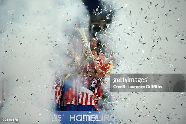 Antonio Lopez of Atletico Madrid lifts the UEFA Europa League trophy following his team's victory after extra time at the end of the UEFA Europa...