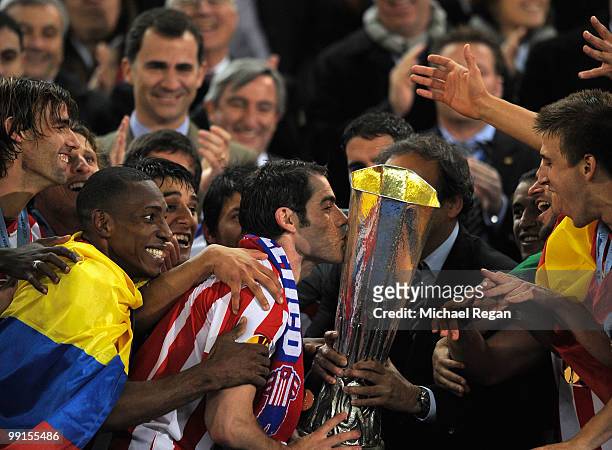 Antonio Lopez of Atletico Madrid kisses the UEFA Europa League trophy after extra time following their victory at the end of the UEFA Europa League...