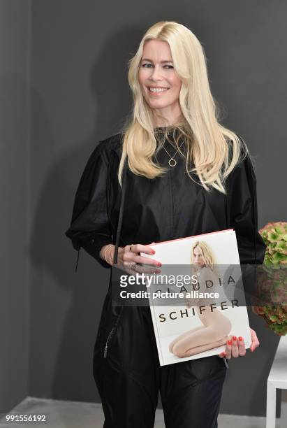 Supermodel Claudia Schiffer arriving to an autograph signing session on the occasion of a photo exhibition on her career taking place in the...