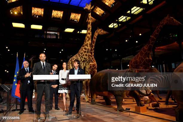 French Prime Minister Edouard Philippe delivers his speech next to French Minister for the Ecological and Inclusive Transition Nicolas Hulot during...