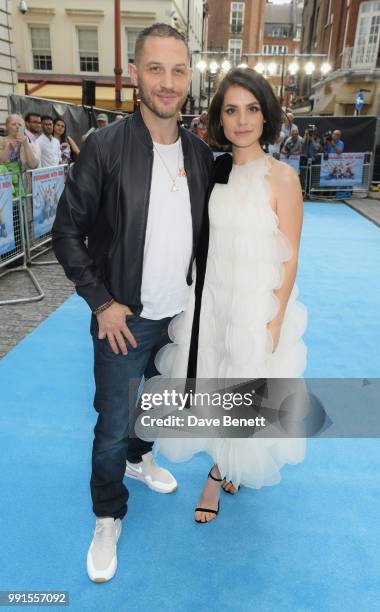 Tom Hardy and Charlotte Riley attend the UK Premiere of "Swimming With Men' at The Curzon Mayfair on July 4, 2018 in London, England.