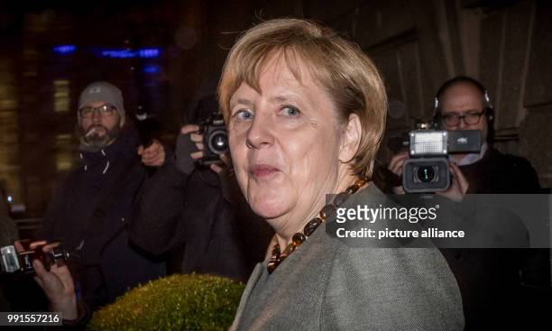 German Chancellor Angela Merkel leaves after another session of exploratory talks for the so-called "Jamaika coalition" between the CDU/CSU, FDP and...