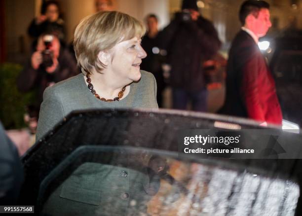 German Chancellor Angela Merkel leaves after another session of exploratory talks for the so-called "Jamaika coalition" between the CDU/CSU, FDP and...