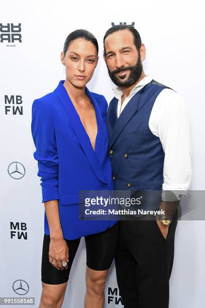 Rebecca Mir and Massimo Sinato attend the Riani show during the Berlin Fashion Week Spring/Summer 2019 at ewerk on July 4, 2018 in Berlin, Germany.