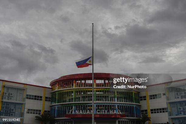 Philippine flag at half mast is seen at the city hall grounds where Tanauan Mayor Antonio Halili was assassinated by a suspected gunman while taking...