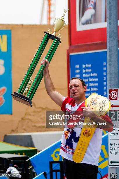 Joey Chestnut celebrates after winning the annual Nathan's Hot Dog Eating Contest on July 4, 2018 in the Coney Island neighborhood of the Brooklyn...