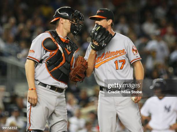 Brian Matusz and Matt Wieters of the Baltimore Orioles talk against the New York Yankees on May 4, 2010 in the Bronx borough of New York City. The...