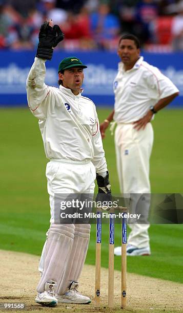 Neil Burns of Leicestershire watches as a delivery from Phil De Freitas is sent to the boundary by Chris Schofield of Lancashire during the C&G...