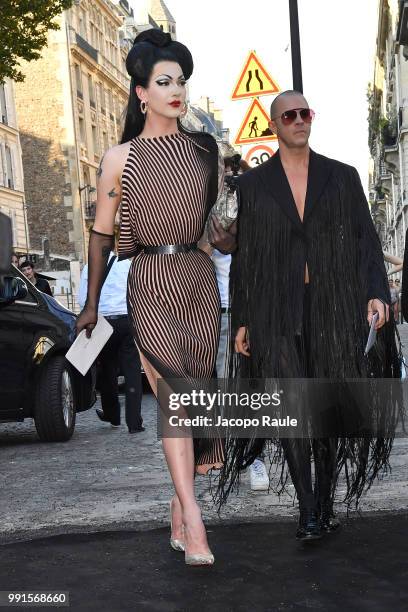 Violet Chachki and Casey Spooner arrive at the 'Vogue Foundation Dinner 2018' at Palais Galleria on July 3, 2018 in Paris, France.