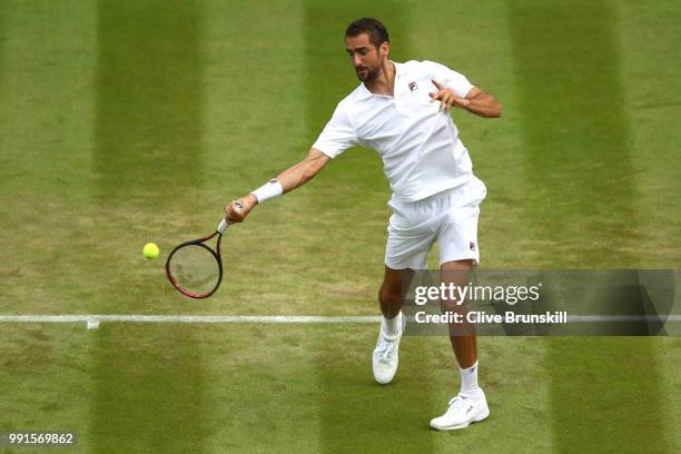 Marin Cilic of Croatia returns against Guido Pella of Argentina during their Men's Singles second round match on day three of the Wimbledon Lawn...