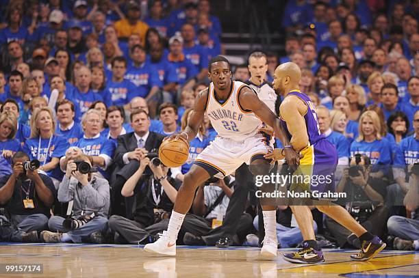 Jeff Green of the Oklahoma City Thunder dribbles against Derek Fisher of the Los Angeles Lakers in Game Six of the Western Conference Quarterfinals...