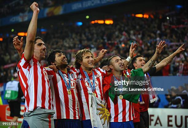 Diego Forlan , Sergio Aguero , Raul Garcia and Simao of Atletico Madrid celebrate their victory after extra time at the end of the UEFA Europa League...