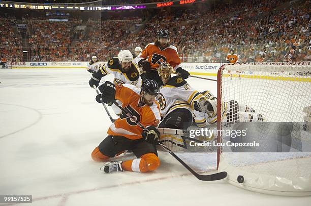 Boston Bruins goalie Tuukka Rask and Mark Stuart in action vs Philadelphia Flyers Ville Leino and Scott Hartnell . Game 4. Philadelphia, PA 5/7/2010...