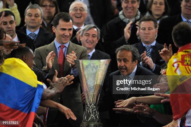 Spanish Prince Felipe and UEFA president Michel Platini present the UEFA Europa League trophy and the end of the UEFA Europa League final match...