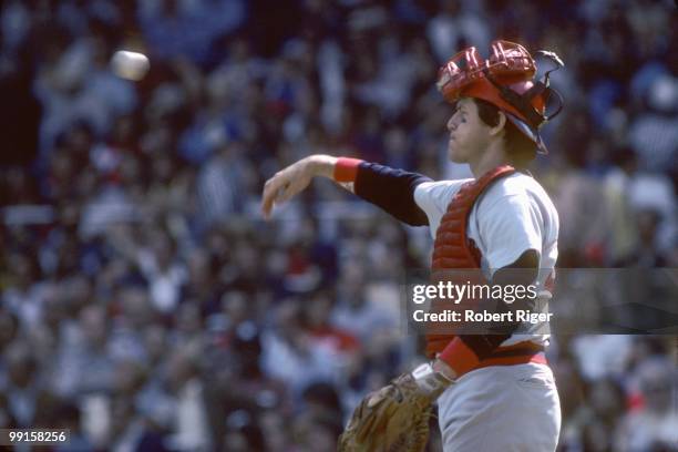 Carlton Fisk of the Boston Red Sox throws during the game against the New York Yankees at Yankee Stadium on September 17, 1978 in the Bronx, New York.