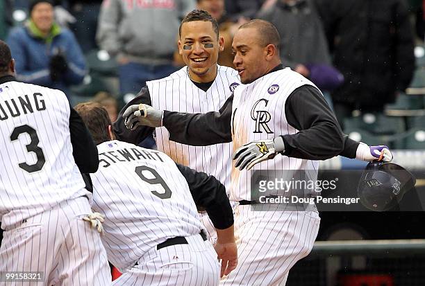 Catcher Miguel Olivo of the Colorado Rockies is welcomed home after his game winning solo homerun off of Chad Durbin of the Philadelphia Phillies in...