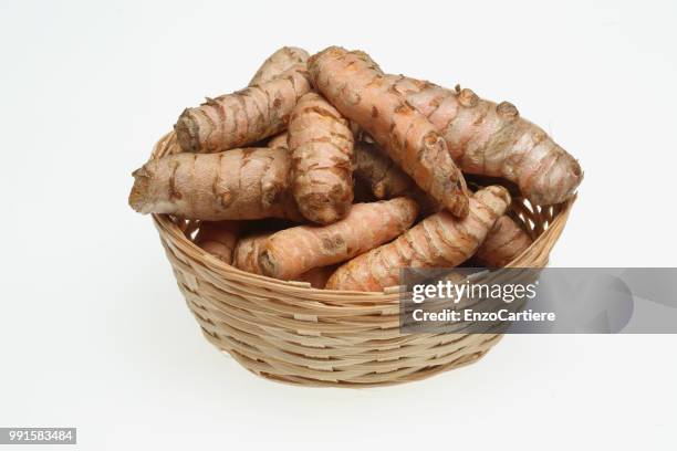 turmeric, curcuma longa, a rhizomatous herbaceous perennial plant as spice and medicinal herb - curcuma stock pictures, royalty-free photos & images