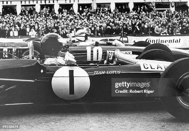 Jim Clark in the car and Jackie Stewart in the car before the 1965 German Grand Prix at Nuerburgring race track on August 1, 1965 in Nuerburg, West...