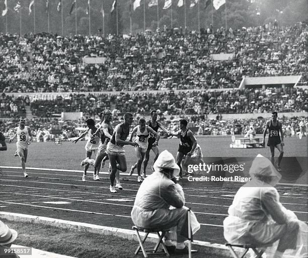 Jack Yerman of the United States hands the baton to teammate Earl Young during the Men's 4X400 Metre Relay in the 1960 Summer Olympics in Rome, Italy.