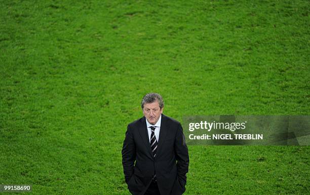 Fulham's head coach Roy Hodgson walks off after the final football match of the UEFA Europa League Fulham FC vs Aletico Madrid in Hamburg, northern...