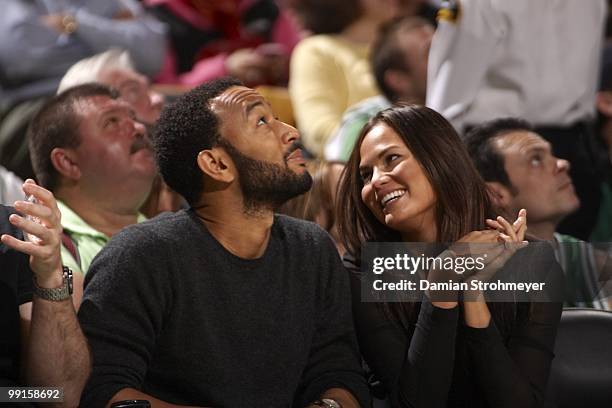 Singer John Legend with girlfriend and Sports Illustrated Swimsuit model Christine Teigen during Boston Celtics vs Cleveland Cavaliers game. Game 4....