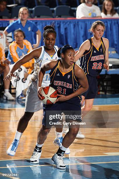 Joy Cheek of the Indiana Fever moves the ball against the Chicago Sky during the WNBA preseason game on May 10, 2010 at the All-State Arena in...