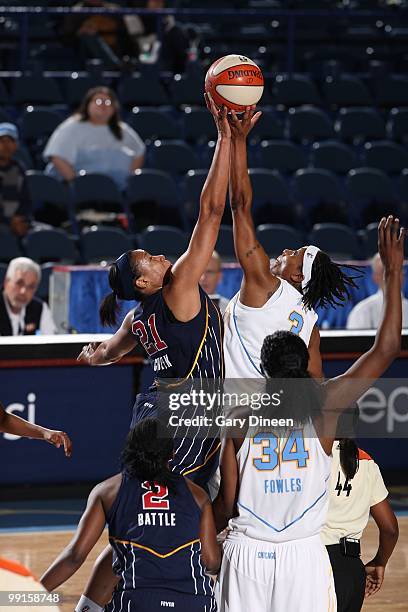 Joy Cheek of the Indiana Fever and Dominique Canty of the Chicago Sky go after a jump ball during the WNBA preseason game on May 10, 2010 at the...