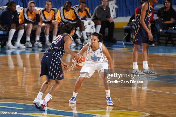 Briann January of the Indiana Fever moves the ball against the Chicago Sky during the WNBA preseason game on May 10, 2010 at the All-State Arena in...