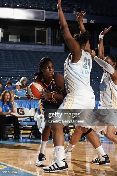 Eshaya Murphy of the Indiana Fever moves the ball against Abi Olajuwon of the Chicago Sky during the WNBA preseason game on May 10, 2010 at the...