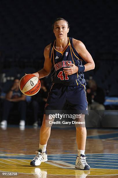 Tully Bevilaqua of the Indiana Fever moves the ball against the Chicago Sky during the WNBA preseason game on May 10, 2010 at the All-State Arena in...