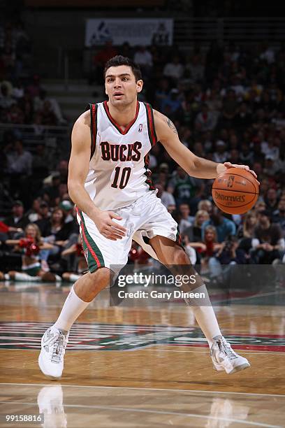 Carlos Delfino of the Milwaukee Bucks moves the ball against the Boston Celtics during the game on April 10, 2010 at the Bradley Center in Milwaukee,...