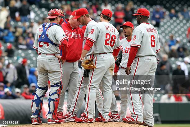 Manaer Charlie Manuel go to the mound to remove starting pitcher Roy Halladay of the Philadelphia Phillies against the Colorado Rockies at Coors...