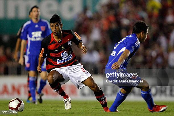 Leo Moura of Flamengo fights for the ball with a player of Universidad de Chile during a match as part of Libertadores Cup at Maracana Stadium on May...