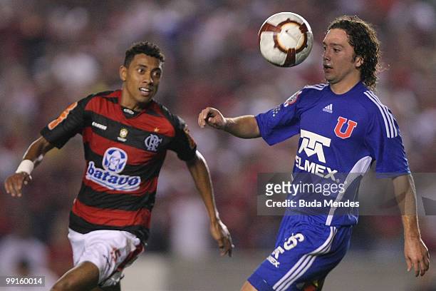 Kleberson of Flamengo fights for the ball with Manuel Iturra of Universidad de Chile during a match as part of Libertadores Cup at Maracana Stadium...