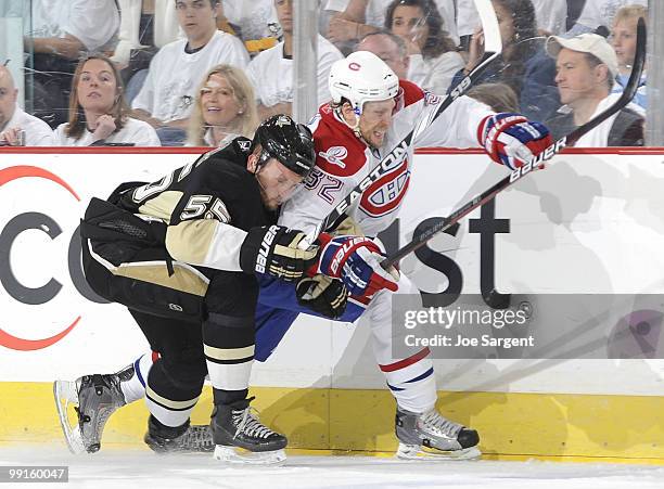 Sergei Gonchar of the Pittsburgh Penguins collides with Travis Moen of the Montreal Canadiens in Game Seven of the Eastern Conference Semifinals...