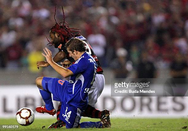 Vagner Love of Flamengo fights for the ball with players of Universidad de Chile during a match as part of Libertadores Cup at Maracana Stadium on...