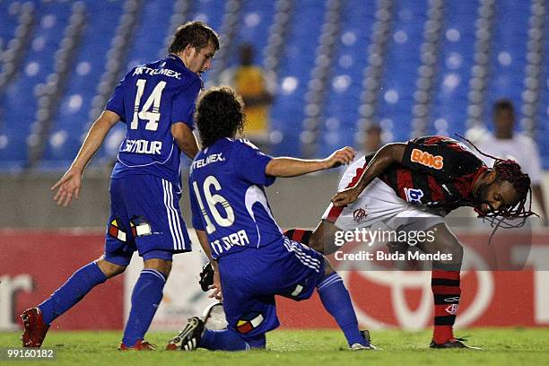 Vagner Love of Flamengo fights for the ball with Felipe Seymour and Manuel Iturra of Universidad de Chile during a match as part of Libertadores Cup...