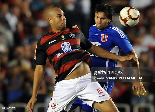 Brazil's Flamengo Adriano vies for the ball with Universidad de Chile's Matias Rodriguez during their Libertadores Cup quarterfinal football match on...