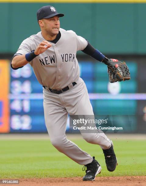 Derek Jeter of the New York Yankees goes after a ground ball in the first game of a double header against the Detroit Tigers at Comerica Park on May...