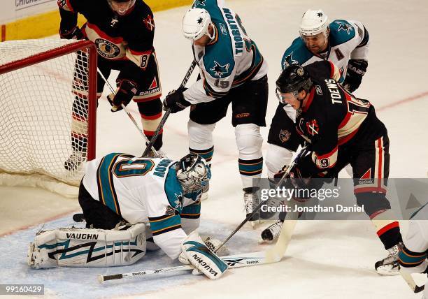 Evgeni Nabokov of the San Jose Sharks stops a shot by Jonathan Toews of the Chicago Blackhawks at the United Center on December 22, 2009 in Chicago,...