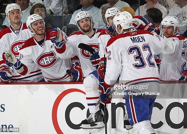 Travis Moen of the Montreal Canadiens celebrates his shorthanded goal with the bench against the Pittsburgh Penguins in Game Seven of the Eastern...