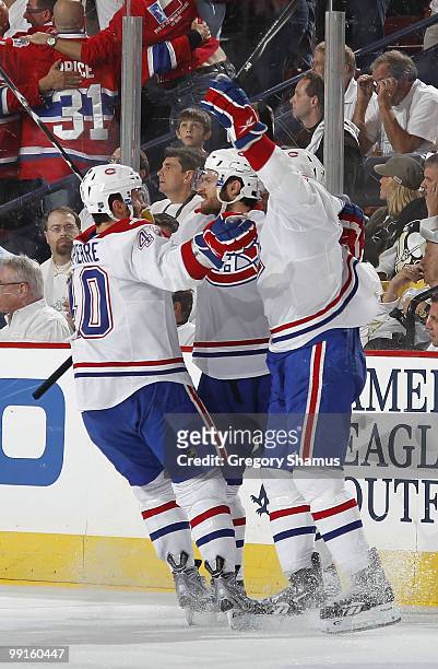 Dominic Moore of the Montreal Canadiens celebrates his goal with teammates against the Pittsburgh Penguins in Game Seven of the Eastern Conference...