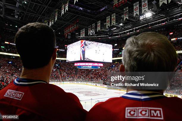 Fans watch Game Seven of the Eastern Conference Semifinals between the Montreal Canadiens and the Pittsburgh Penguins on the Bell Centre video system...